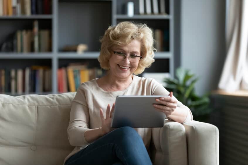 Woman with hearing loss using a tablet